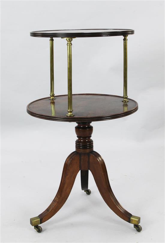 A Regency mahogany revolving two tier whatnot, Diam. 1ft 10in. H.3ft 2in.